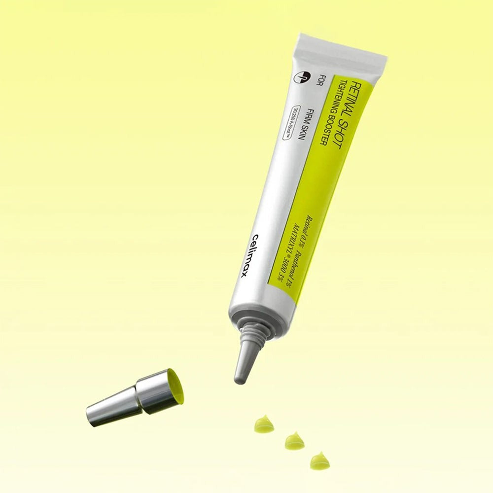 CELIMAX Retinol Shot Tightening Booster 15ml tube with open cap on yellow background