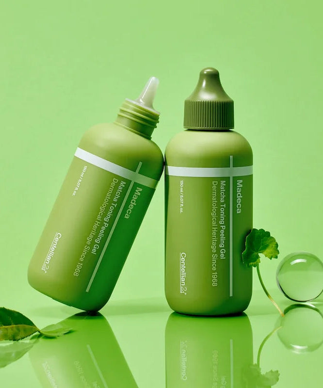 CENTELLIAN 24 Madeca Matcha Toning Peeling Gel 150ml bottles on green background with leaves and clear sphere.