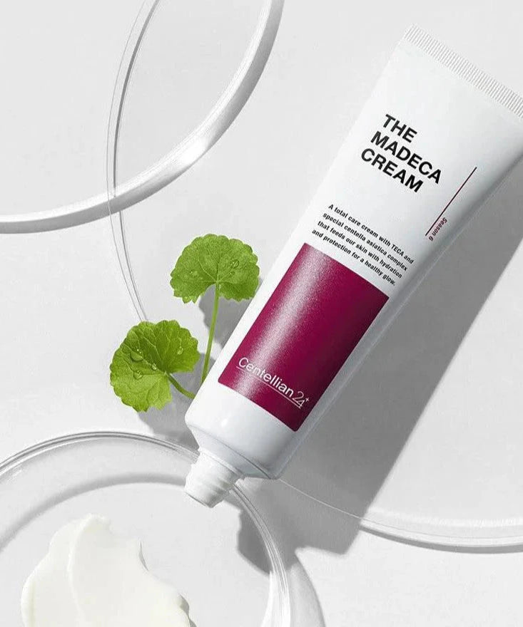 CENTELLIAN 24 The Madeca Cream 50ml tube with glossy background and green leaf, highlighting skincare product features.