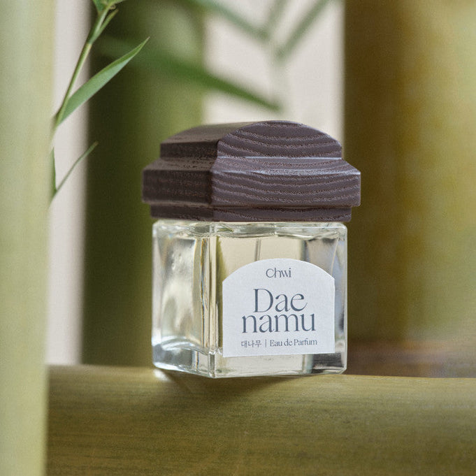 CHWI (CHI) Eau De Parfume 50ml bottle on natural background showcasing elegant design and premium branding.