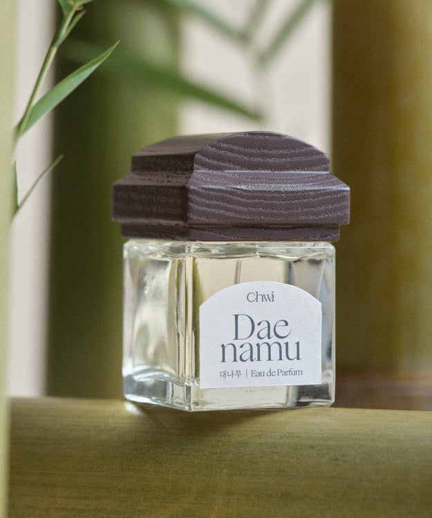 CHWI (CHI) Eau De Parfume 50ml bottle on natural background showcasing elegant design and premium branding.