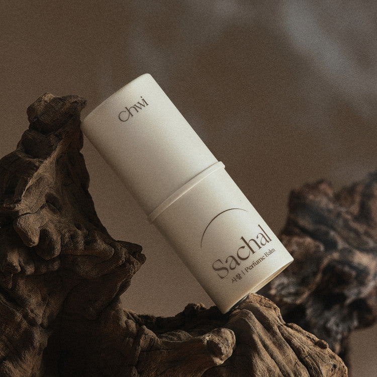 CHWI (CHI) Parfume Balm 4.6g displayed on natural wood setting.