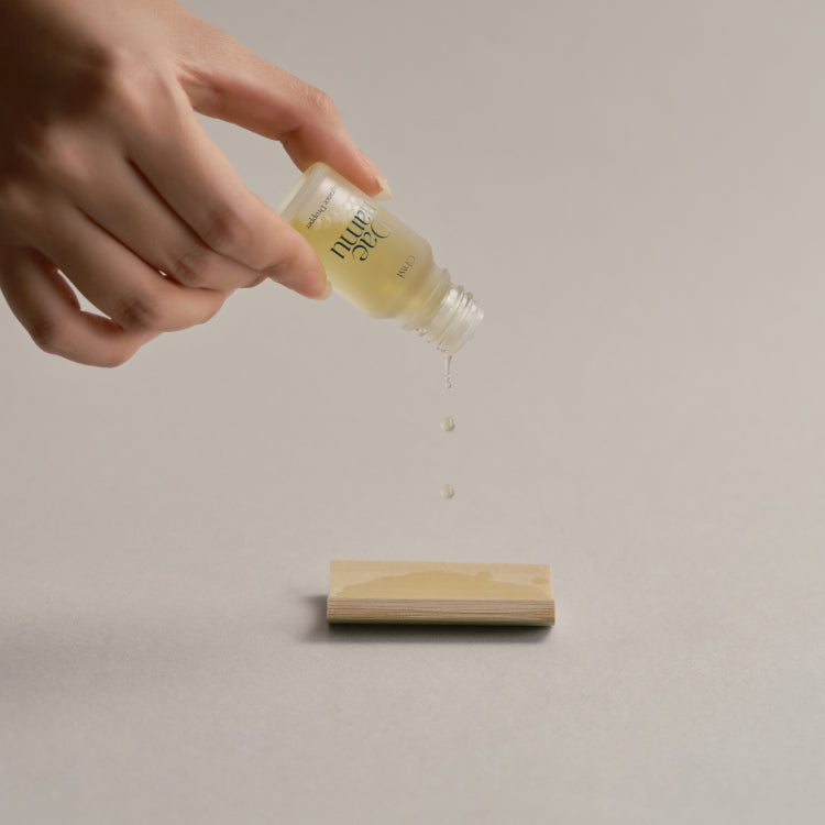 CHWI (CHI) Dae Namu Frangrance Dropper 10ml being used, aromatic liquid dropping from bottle.