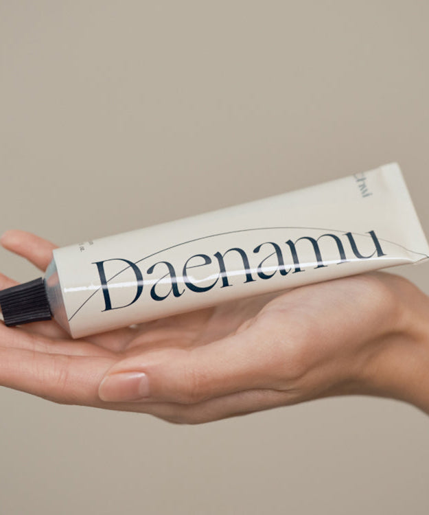 CHWI (CHI) Dae Namu Hand Cream 50ml tube displayed on a hand, showcasing the product's packaging.