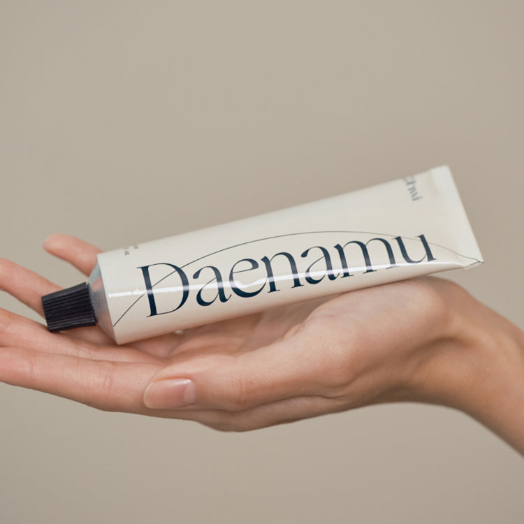 CHWI (CHI) Dae Namu Hand Cream 50ml tube displayed on a hand, showcasing the product's packaging.