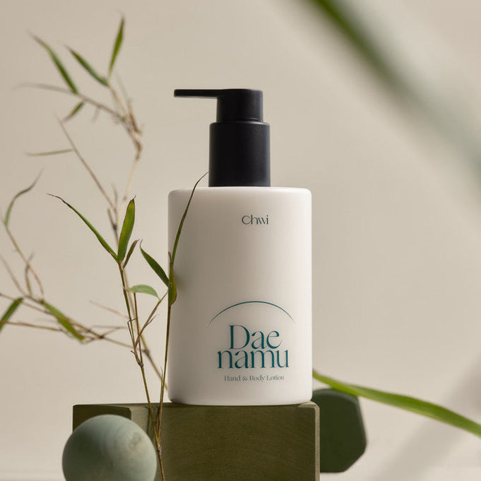 Image of CHWI (CHI) Dae Namu Hand & Body Lotion 300ml bottle with natural bamboo aesthetic.
