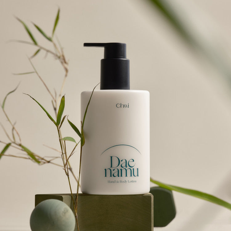 Image of CHWI (CHI) Dae Namu Hand & Body Lotion 300ml bottle with natural bamboo aesthetic.
