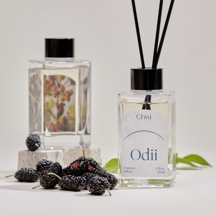 CHWI (CHI) Odii Diffuser 100ml with decorative berries and green leaves on a white surface.