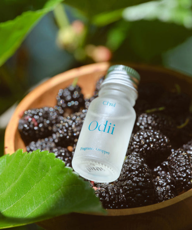 CHWI (CHI) Odii Frangrance Dropper 10ml placed on blackberries with green leaves in background