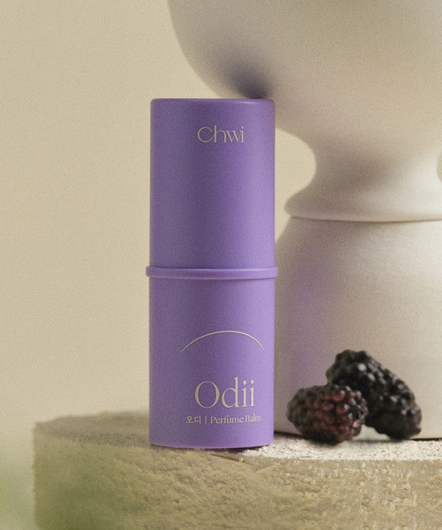 Purple CHWI (CHI) Odii Parfume Balm 4.6g next to blackberries, stylish packaging
