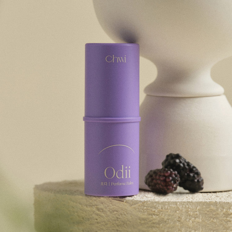 Purple CHWI (CHI) Odii Parfume Balm 4.6g next to blackberries, stylish packaging