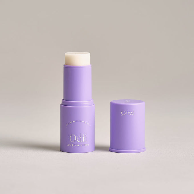 Purple CHWI (CHI) Odii Parfume Balm 4.6g in open container with cap beside, showcasing the balm stick for fragrance application.
