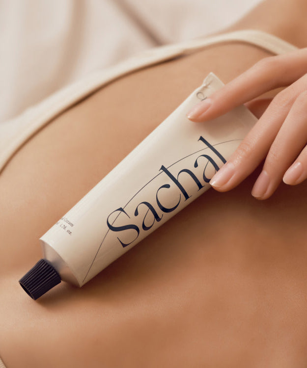 CHWI (CHI) Sachal Hand Cream 50ml on skin, showcasing packaging and texture.