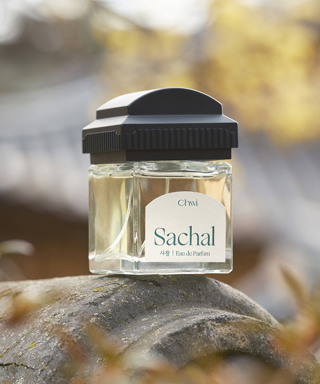 CHWI (CHI) Sachal Parfume 50ml bottle on a natural outdoor setting, showcasing its elegant design and branding.