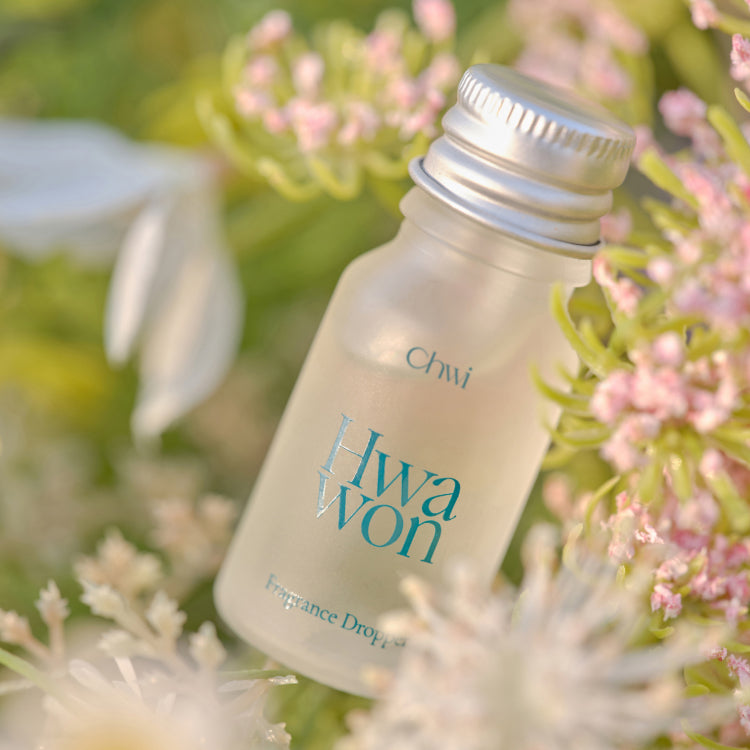 CHWI (CHI) Wha Won Fragrance Dropper 10ml amid blooming flowers