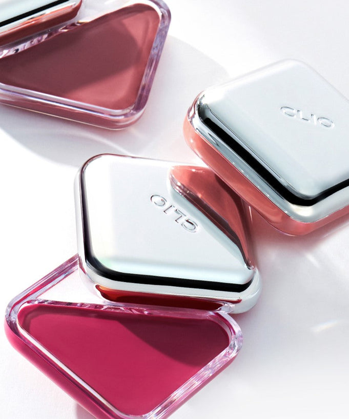 CLIO Essential Lip Cheek in sleek containers with vibrant shades, perfect for both lips and cheeks, offering a fresh and stylish look.