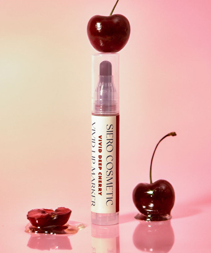 COSIERO Vivid Lip Marker in vibrant cherry shade with fresh cherries backdrop.