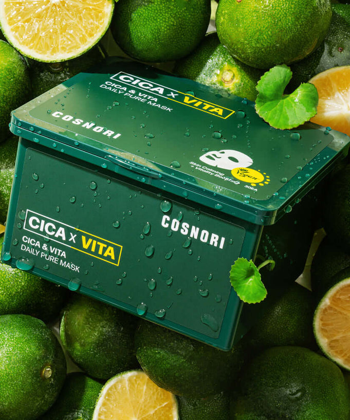 COSNORI Cica & Vita Daily Pure Mask 35ml surrounded by fresh lime slices, showcasing the vibrant green packaging.