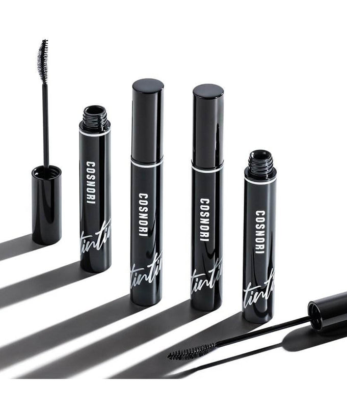 COSNORI Eyelash Tinting Serum Deep Black mascara tubes with applicators on a white background