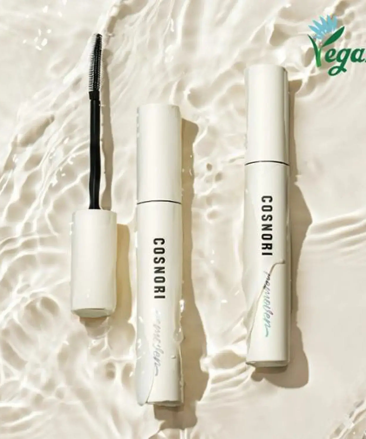Image of COSNORI Long Active Mascara Remover with vegan logo in minimalist packaging on textured background.