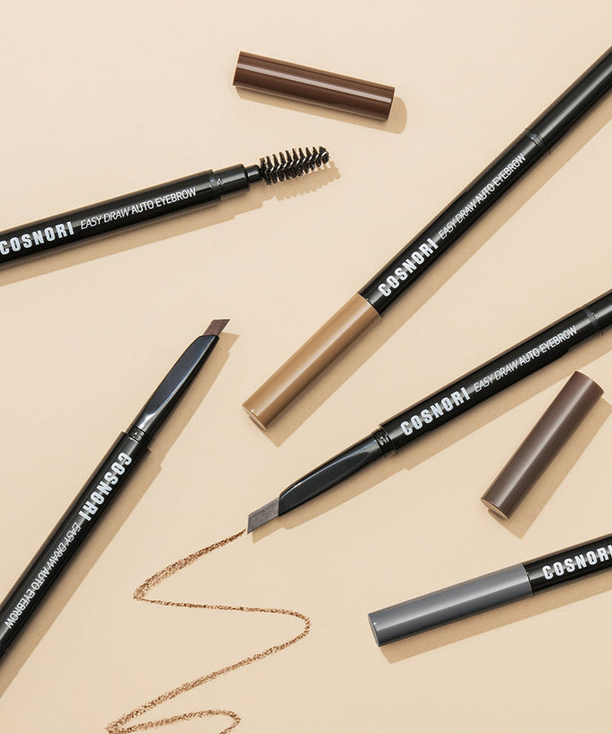 COSNORI Easy Draw Auto Eyebrow pencils in various shades with caps off and pencil tips visible on a beige background.