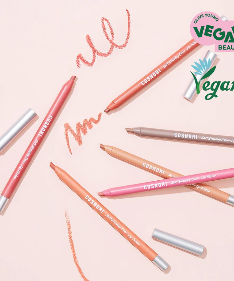 COSNORI Soft Drawing Overlip Maker vegan beauty product lying on a pink surface with various colors and designs.