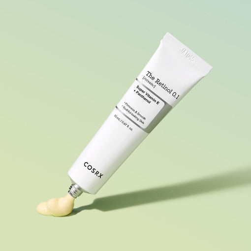 COSRX The Retinol 0.1 Cream 20ml tube on green background with cream dispensed