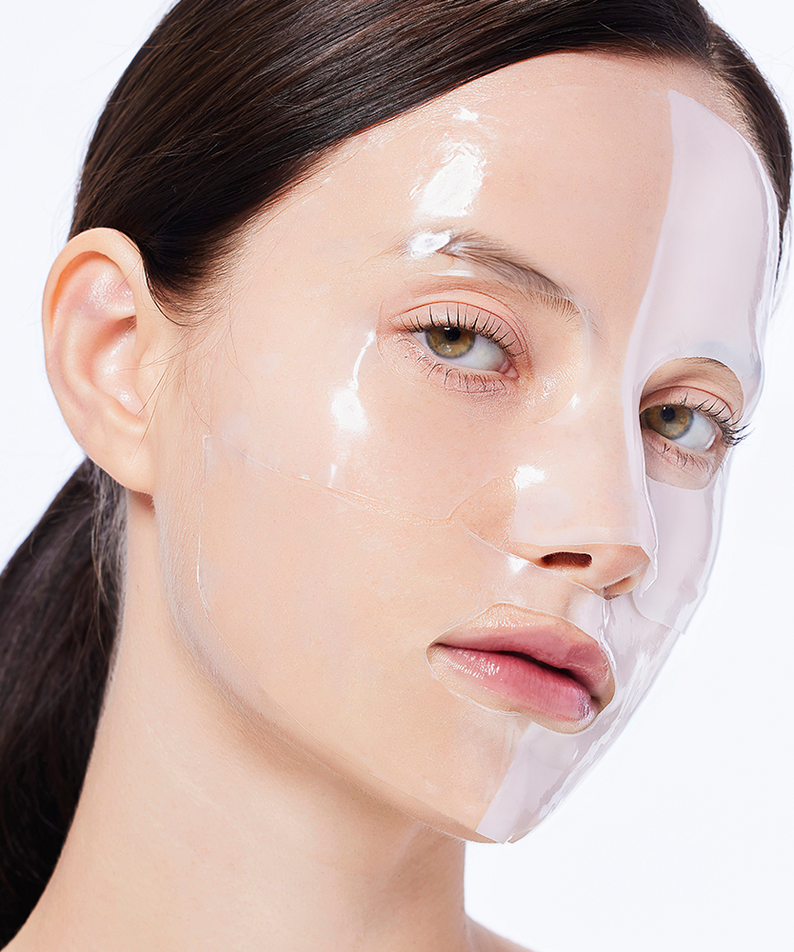 Woman wearing COSRX Advanced Snail Mucin Glass Glow Hydrogel Mask (3 mask) for skincare