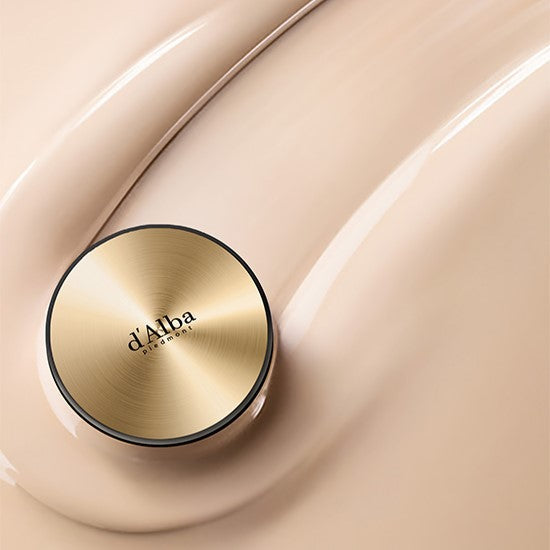 D'ALBA Glow Fit Serum Cover Cushion on smooth beige background, showcasing luxurious makeup product packaging.