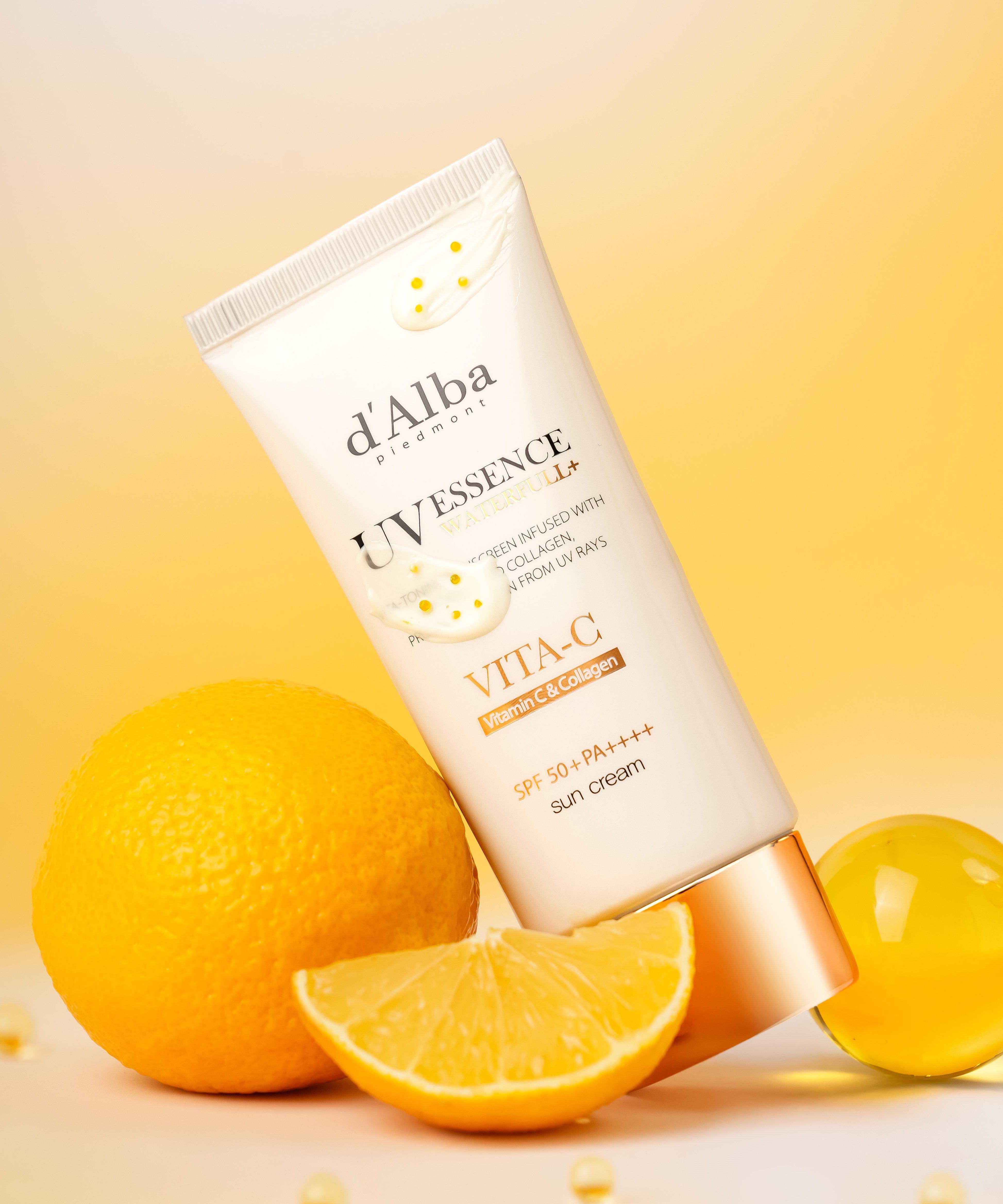 D'ALBA Vegan Waterfull Vita C Suncream 50ml on a citrus background with oranges and sunlight