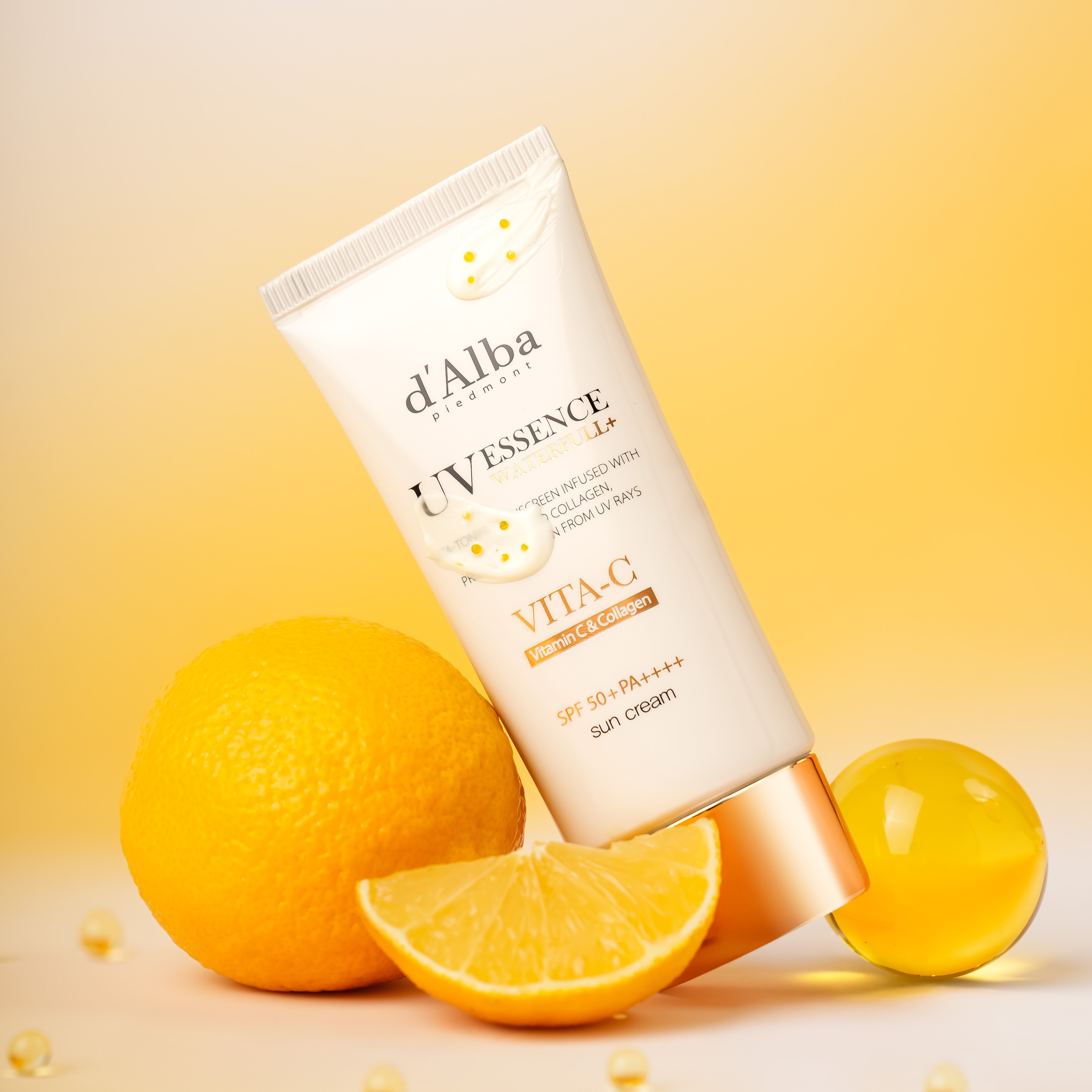 D'ALBA Vegan Waterfull Vita C Suncream 50ml on a citrus background with oranges and sunlight