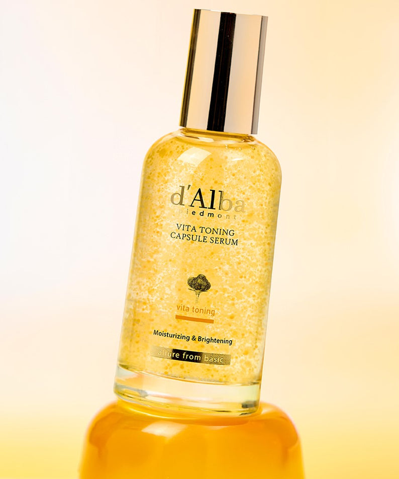 D'ALBA Vita Toning Capsule Serum bottle against a yellow background