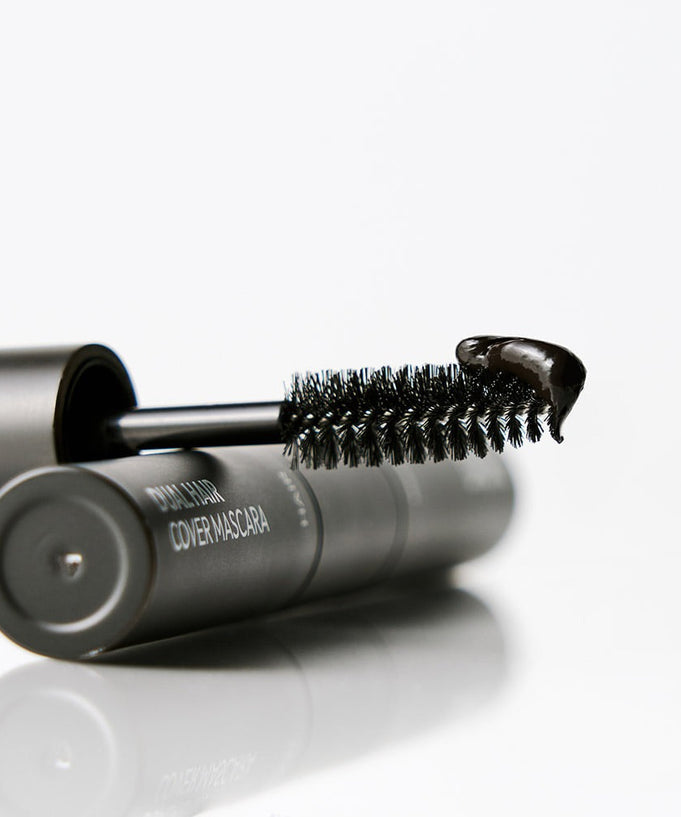 Close-up of DASHU Daily Dual Hair Cover Mascara wand with product on the tip