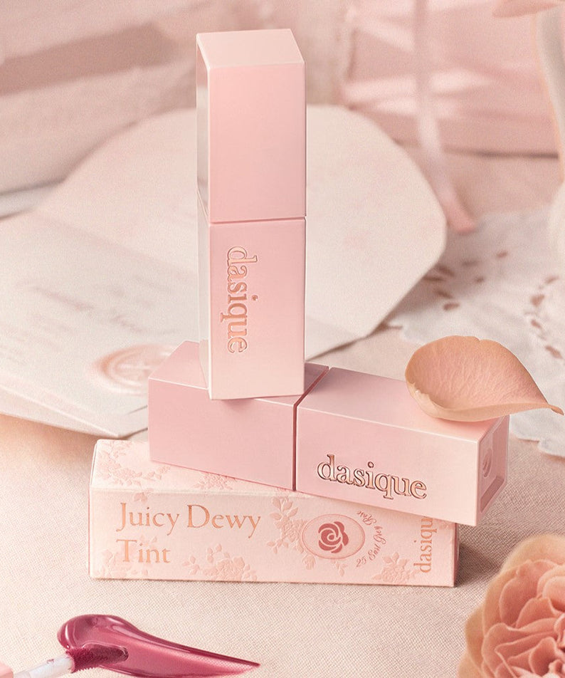 DASIQUE Juicy Dewy Tint #RoseMilkTeaCollection in elegant packaging with a delicate rose theme.