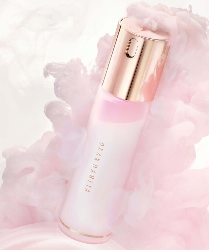 DEAR DAHLIA Endless Skin Cream Mist in elegant pink and golden bottle surrounded by soft pastel clouds for a luxurious feel