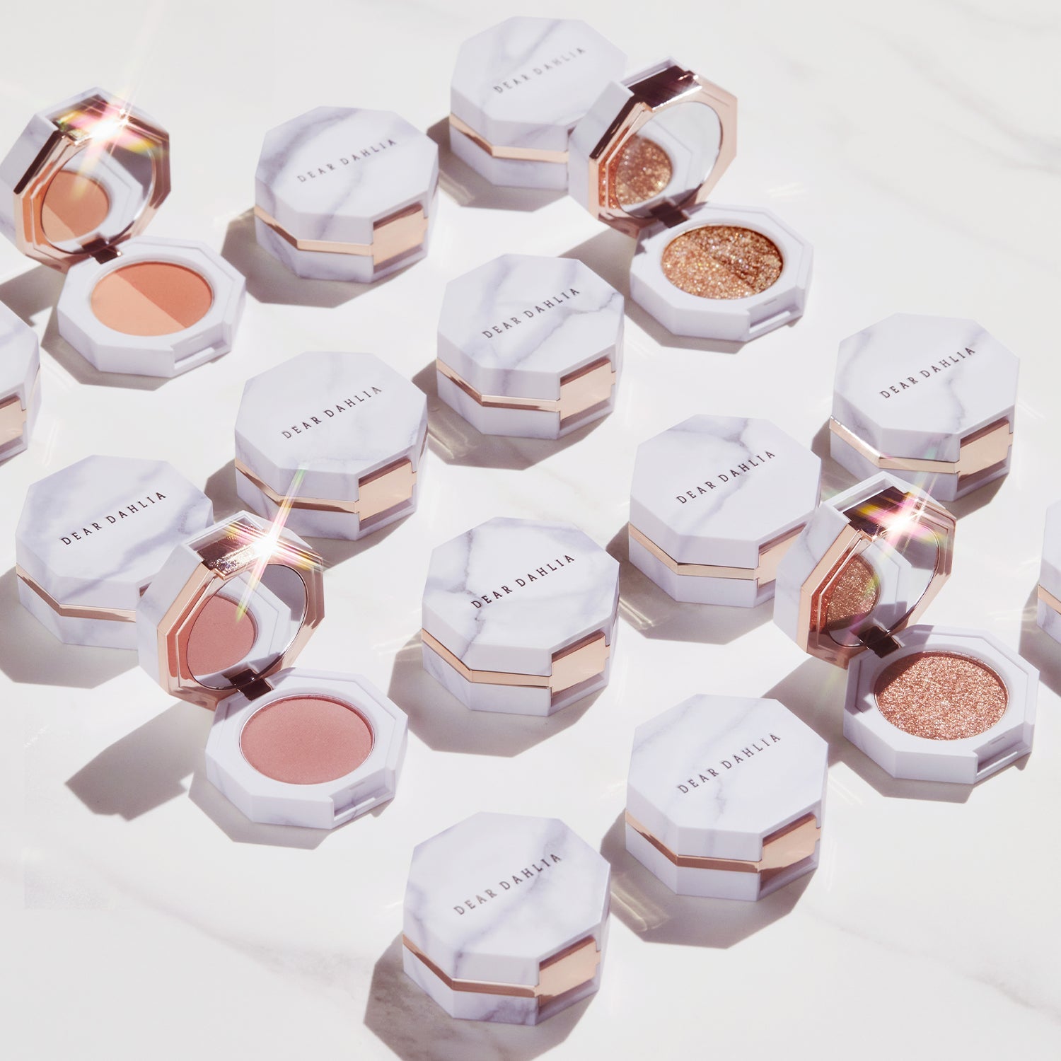 DEAR DAHLIA Paradise Dual Palette with various makeup shades in elegant marble packaging.