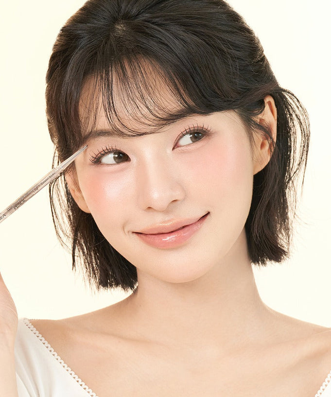 Woman using DEAR.A 0.9mm Eyebrow pencil for precise eyebrow definition