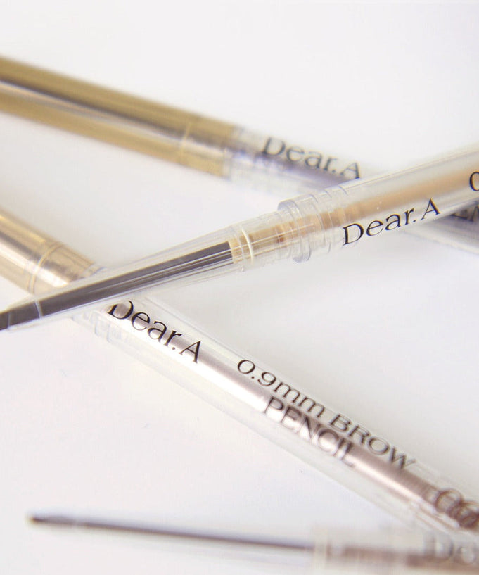 Close-up of DEAR.A 0.9mm Eyebrow pencil showing fine tip and product details.