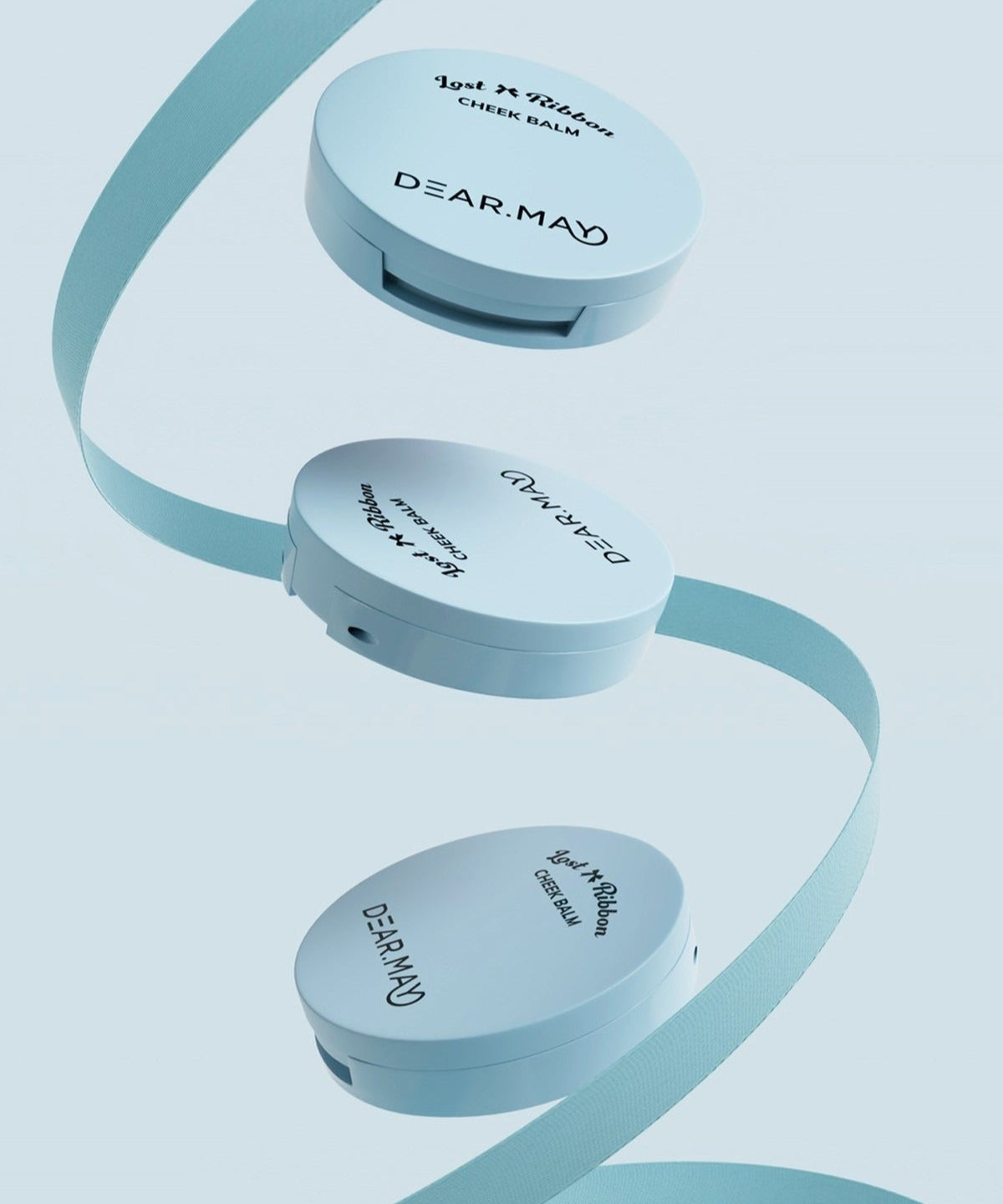 DEAR MAY Lost Ribbon Check Balm in sleek packaging with decorative ribbon, showcasing elegant design and branding.