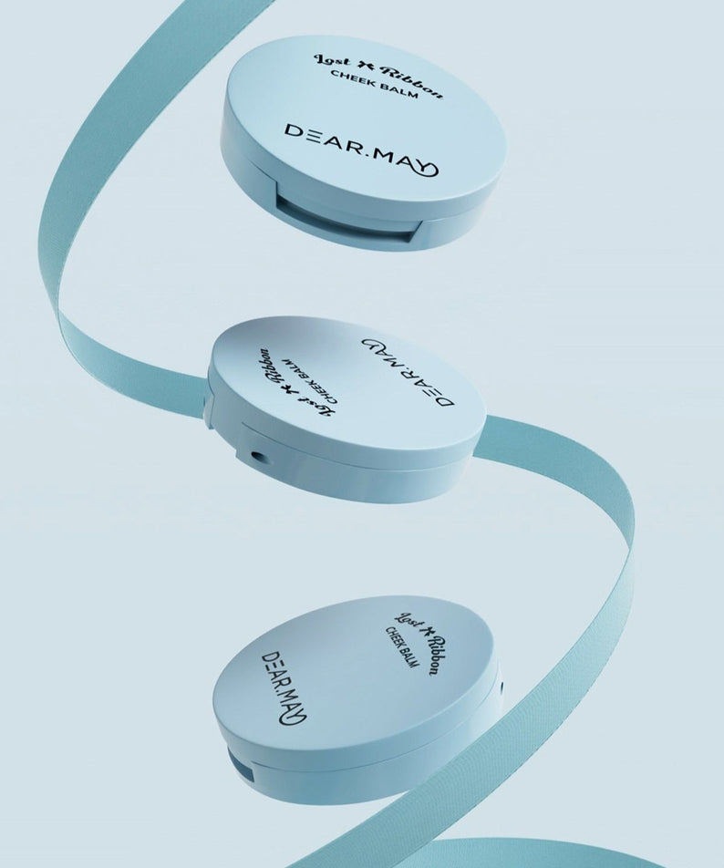 DEAR MAY Lost Ribbon Check Balm in sleek packaging with decorative ribbon, showcasing elegant design and branding.