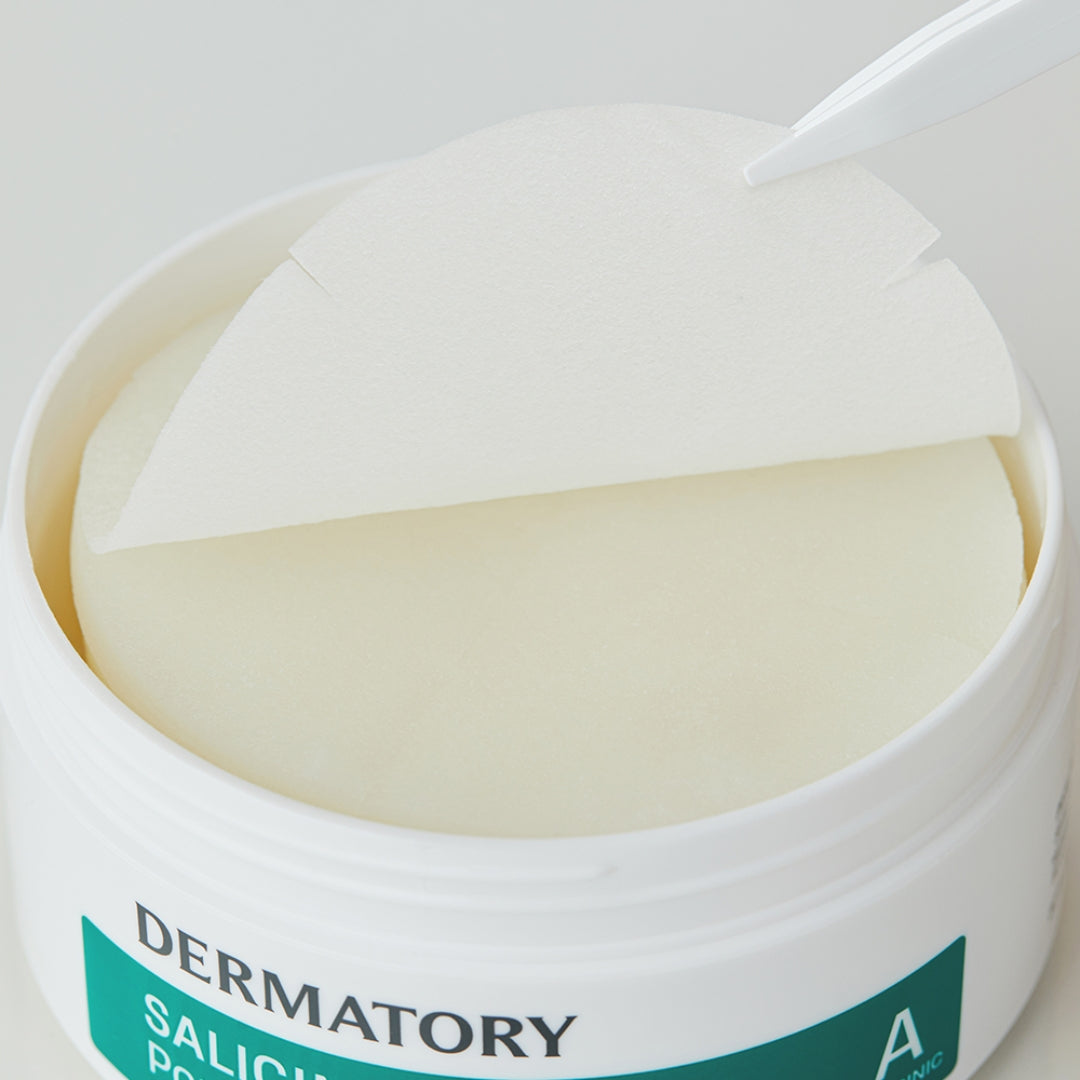 Open container of DERMATORY Salicinic Pore Trouble Melting Pad 30 Sheets with tweezers lifting a pad