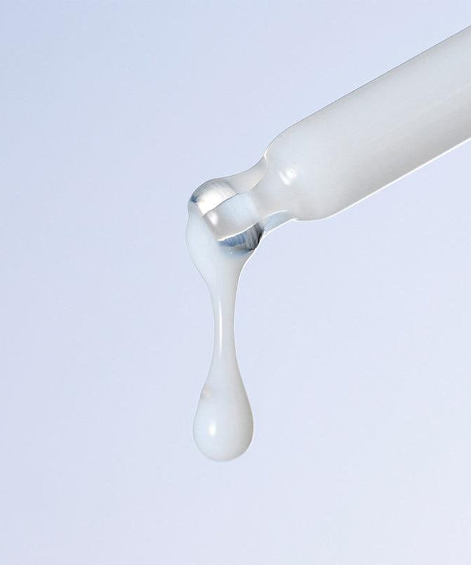 Dropper dispensing DERMATORY Hyal Shot Barrier Cream Ampoule B5 50ml onto surface