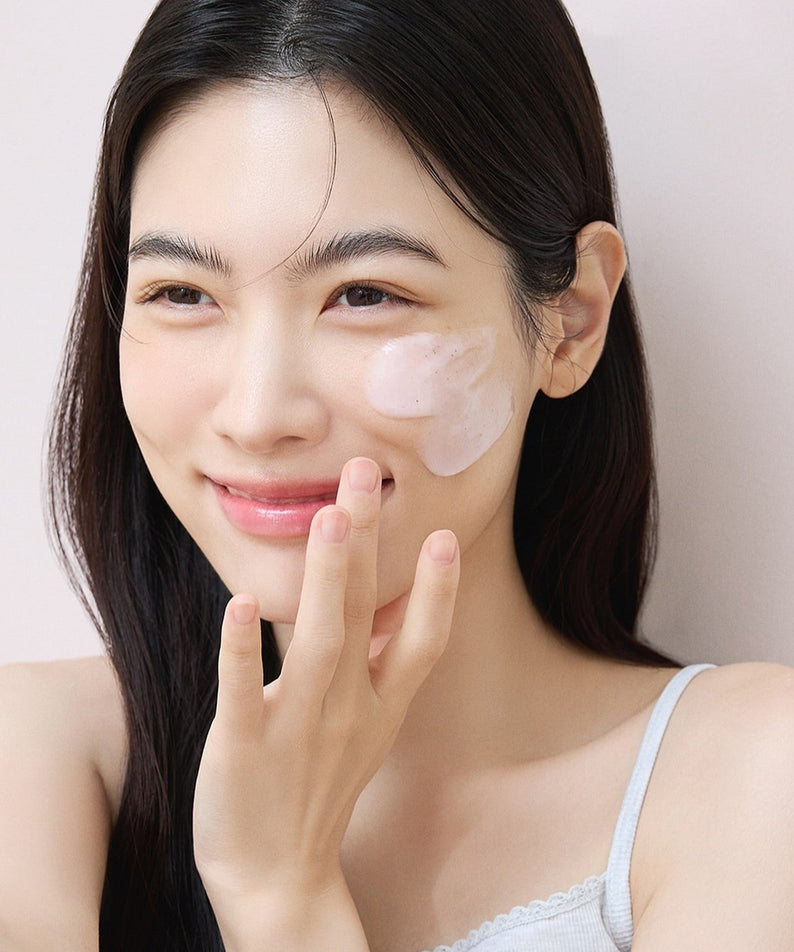 Woman applying DERMATORY Modeling Pack 66g on her face for skincare.