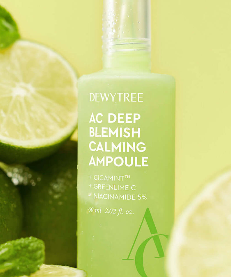 DEWYTREE AC Deep Trace Soothing Ampoule Planning Set 60ml surrounded by fresh limes, showcasing its soothing properties.