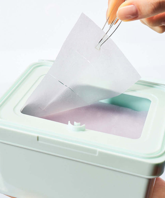 DEWYTREE Pick & Quick Collagen Pore Elasticity Tear-Off Double Pad 100 sheets in use, showing pad being removed from container.