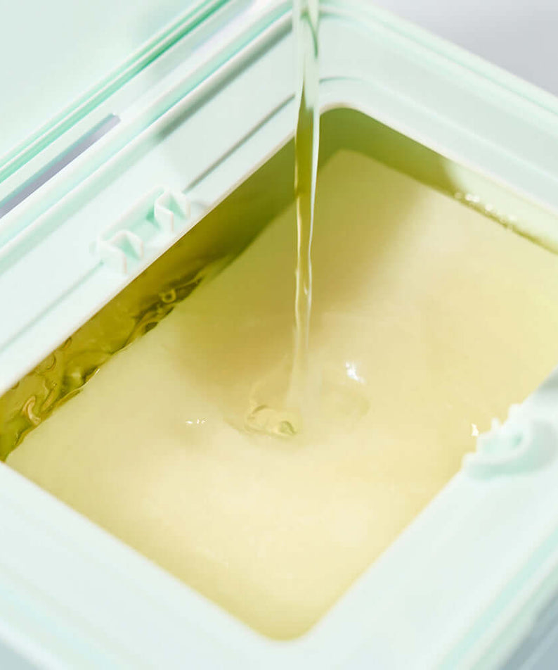 DEWYTREE Pick & Quik Vitamin Glow Tear-Off Double Pads 100 sheets - close-up of pads being soaked with vitamin serum