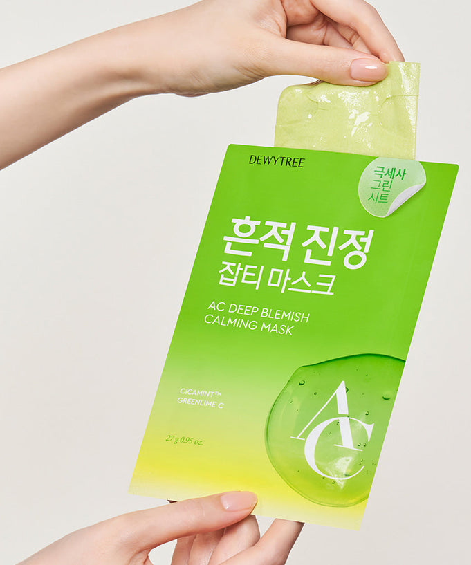 Close-up of DEWYTREE AC Deep Blemish Calming Mask 10 Sheets package held by a hand, displaying the green packaging and mask sheet.