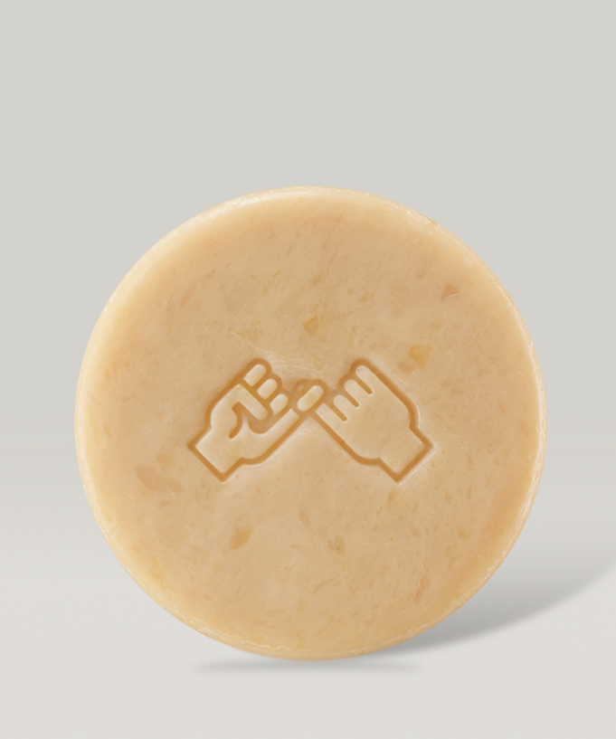 DONGGUBAT Dishwashing Soap Green Tangerine 100g round bar with hand design on light background