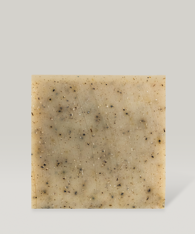 Square bar of DONGGUBAT Field Dream Soap Basil with natural speckles on a light background.