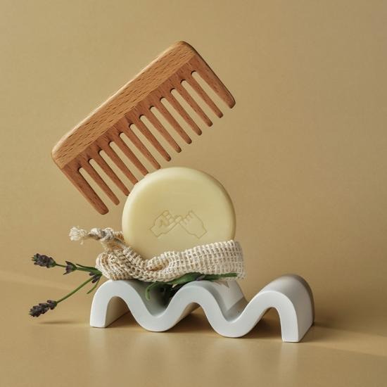 DONGGUBAT Correct Shampoo Bar For Oily Skin with wooden comb on decorative stand